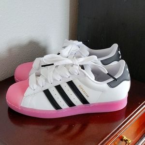 White classic addidas with Bubble Gum sole.